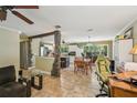 Open-concept living area showcasing decorative rock detail and tiled flooring at 4468 Maraldo Ave, North Port, FL 34287