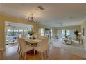 Open-concept dining and living area filled with natural light and stylish furnishings at 5039 Kestral Park Dr # 67, Sarasota, FL 34231