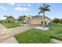 Street view of single story home with a two car garage, and lush lawn at 5902 106Th E Ter, Parrish, FL 34219