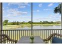 Enjoy gorgeous views from this screened-in lanai with seating and a great view of the lake and the golf course at 7005 River Hammock Dr # 203, Bradenton, FL 34212