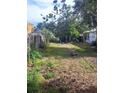 Lawn with metal supports for possible tenting or awning system; swing set in background at 710 25Th W Ave, Bradenton, FL 34205