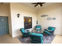 Cozy screened patio features seating, neutral colors, and modern decor at 7235 River Hammock Dr # 204, Bradenton, FL 34212