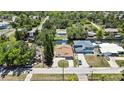An aerial view showing the property's location on a canal with easy access to the water and nearby homes at 7308 Maryland Ave, Hudson, FL 34667