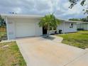 Well-maintained home with a tidy front yard and a driveway leading to an attached garage at 1902 24Th W Ave, Bradenton, FL 34205