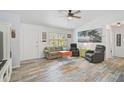 Bright living room featuring stylish flooring, comfortable seating, and ample natural light at 2127 Corfell St, Port Charlotte, FL 33948