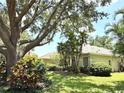 A lush backyard with mature trees and landscaping provides privacy and a natural setting at 2809 112Th E Ter, Parrish, FL 34219