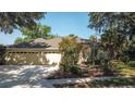 A lovely home is enhanced by a well-manicured lawn and three-car garage, offering space and curb appeal at 2809 112Th E Ter, Parrish, FL 34219