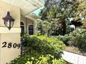 Charming home entrance with beautiful landscaping and visible address for easy identification at 2809 112Th E Ter, Parrish, FL 34219