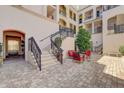 Beautiful courtyard with brick pavers, wrought iron railings, seating, and lush landscaping create a relaxing outdoor space at 525 N Orange Ave # 202, Sarasota, FL 34236