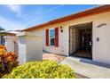 Elegant entry with an ornate security gate and colorful landscaping providing a welcoming entrance at 6701 12Th W Ave, Bradenton, FL 34209