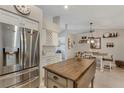 Bright kitchen featuring stainless steel appliances, custom cabinets, and a stylish kitchen island at 6766 Beedla St, North Port, FL 34291