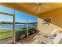 Relaxing screened patio with scenic views of the lake, perfect for outdoor seating and enjoyment at 8422 Wethersfield Run # 103, Lakewood Ranch, FL 34202