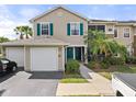 Charming two-story townhome with attached garage, and a screened in lanai with lush landscaping at 8926 Manor Loop # 201, Lakewood Ranch, FL 34202