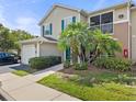 Charming two-story townhome with attached garage and lush landscaping at 8926 Manor Loop # 201, Lakewood Ranch, FL 34202