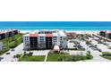 Inviting condo complex near the beach, features manicured lawns and convenient parking for residents at 1945 Gulf Of Mexico Dr # M2-313, Longboat Key, FL 34228