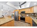 Updated kitchen with stainless steel appliances and a center island at 2419 Riverbluff Pkwy # V233, Sarasota, FL 34231
