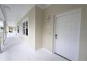 Inviting condo entrance featuring a white front door and neutral tones creating a modern and clean aesthetic at 3803 54Th W Dr # 201, Bradenton, FL 34210