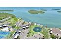Aerial view showcasing a waterfront property with lush surroundings at 4234 Gulf Of Mexico Dr # G2, Longboat Key, FL 34228