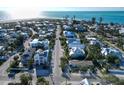 Serene aerial view of a coastal neighborhood with a beautiful view of the ocean at 704 Gladiolus St, Anna Maria, FL 34216