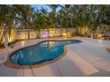 Inviting private pool area surrounded by lush tropical landscaping, perfect for relaxation and entertainment at 704 Gladiolus St, Anna Maria, FL 34216