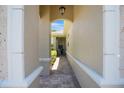 Covered walkway featuring brick pavers and decorative columns at 7164 Rue De Palisades # 5, Sarasota, FL 34238