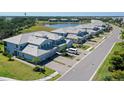 Beautiful townhome with a spacious two-car garage, landscaped lawn, and a community lake nearby at 1017 Tidewater Shores Loop # 1017, Bradenton, FL 34208