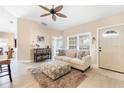 Bright living room with tile floors, neutral paint and a ceiling fan at 10202 L Pavia Blvd # 10202, Venice, FL 34292