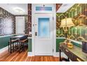 Stylish dining room with designer wallpaper, modern lighting, and a convenient dining table at 1221 N Palm Ave # 303, Sarasota, FL 34236