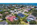 Beautiful aerial view of a coastal neighborhood with lush landscaping and stunning waterfront homes at 180 Lookout Point Dr, Osprey, FL 34229