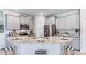 Well-equipped kitchen with stainless steel appliances and granite countertops at 18109 Cropside Trl, Lakewood Ranch, FL 34211