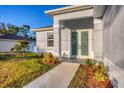 Inviting front entrance with a well-maintained walkway and landscaped garden beds at 2258 Margaret Ln, North Port, FL 34286