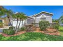 Well-maintained home with mature landscaping, attractive mulch beds and a two-car garage at 4208 Balmoral Way, Sarasota, FL 34238