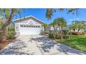 Beautiful single-Gathering home featuring a well-manicured lawn and a two-car garage at 4208 Balmoral Way, Sarasota, FL 34238