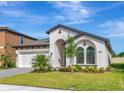 Charming single-story home with a well-manicured lawn and an attached two-car garage at 12613 Oak Hill Way, Parrish, FL 34219
