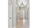Hallway with tile floor, recessed lighting and architectural details at 12642 Cara Cara Loop, Bradenton, FL 34212