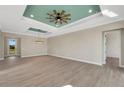 Bright living room featuring tile flooring, recessed lighting, and a decorative ceiling fan at 144 Spring Dr, Rotonda West, FL 33947