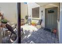 Outdoor brick-paved patio with chairs and potted plants, providing a cozy outdoor space at 157 Pinehurst Dr # 157, Bradenton, FL 34210