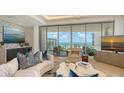 Bright living room features modern decor, ocean views, and comfortable seating at 1591 Gulf Of Mexico Dr # 511, Longboat Key, FL 34228