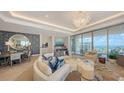 Open-concept living area with stylish furnishings, ocean views, and elegant decor at 1591 Gulf Of Mexico Dr # 511, Longboat Key, FL 34228