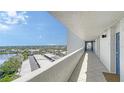 Condo hallway with tile flooring and views of the city and water at 19 Whispering Sands Dr # 805, Sarasota, FL 34242