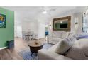 Bright living room showcasing a comfortable sofa, stylish decor, and a dining area bathed in natural light at 2006 7Th W Ave # B, Bradenton, FL 34205