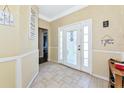 Bright and spacious foyer featuring tiled floors and classic white trim at 230 Fareham Dr, Venice, FL 34293