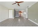 Open-concept living area with tile flooring, leading to kitchen and other rooms at 2704 Hidden Lake Blvd # C, Sarasota, FL 34237