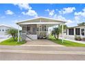 Inviting home with a covered parking area, front porch and grill, nestled among well-maintained landscaping at 3333 26Th E Ave # 1104, Bradenton, FL 34208
