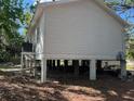 Side view of the house showing the stilt foundation at 35236 Reynolds St, Dade City, FL 33523