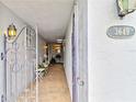 Inviting walkway leading to the front door with decorative gate at 3649 Somerville Dr # 1507, Sarasota, FL 34232