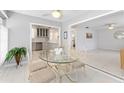 Bright dining area with decorative table set, adjacent to the updated kitchen space at 3978 Overlook Bend Ter # 25, Sarasota, FL 34232