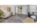 Bright living room boasting modern gray floors, stylish furnishings, and an open, airy layout at 4151 Olive Ave, Sarasota, FL 34231