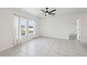 Bright, spacious bedroom with tiled floors, and natural light from large windows at 4503 Lindever Ln, Palmetto, FL 34221