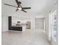 Open concept kitchen featuring stainless steel appliances, granite countertops, and modern pendant lighting at 4503 Lindever Ln, Palmetto, FL 34221